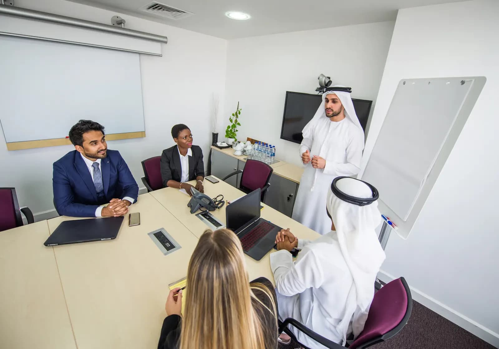 Infoline consultants leading a client workshop in Muscat